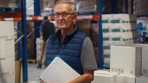 Portrait of caucasian mature man in warehouse. Shot with RED helium camera in 8K.