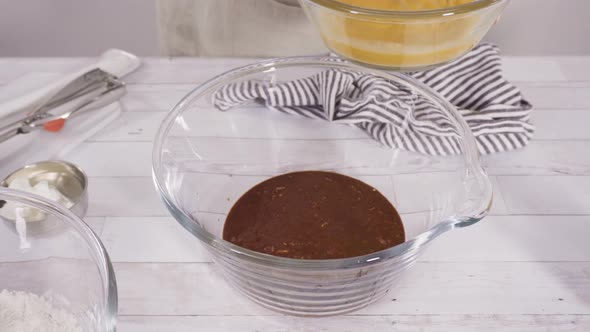 Mixing ingredients to bake chocolate raspberry cupcakes.