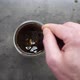 Top View of Person Hand Steering Coffee in a Cup with Spoon - VideoHive Item for Sale