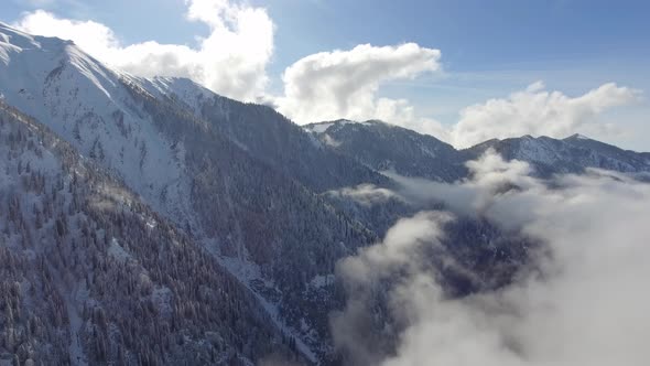 Flying Over the Clouds Covering the Valley