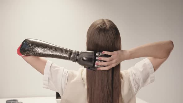 Rear View of Woman with Prosthetic Arm