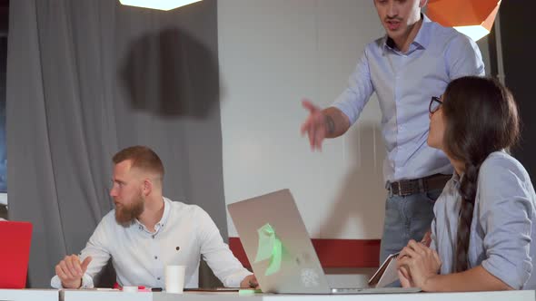 Angry Manager Man Is Shouting on Female Worker in Office Looking in Her Laptop