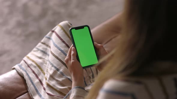 Woman with Smartphone Green Screen Mock Up Display, Over the Shoulder, Close Up Shot, Tech App Ad