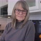 Portrait of senior woman with glasses looking at camera in her kitchen - VideoHive Item for Sale