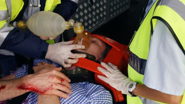 Emergency medical technicians taking care of their wounded person