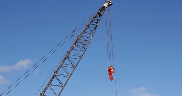 Construction hook swaying from the wind