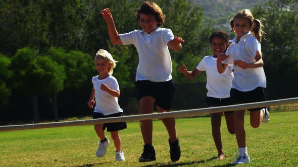 Children running in park during race