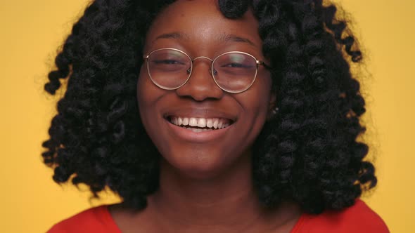 Close Up of Young African Woman Feeling Happiness at Studio