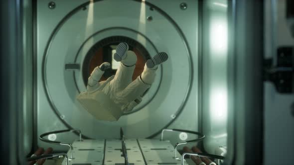 Astronaut Inside the Orbital Space Station alt