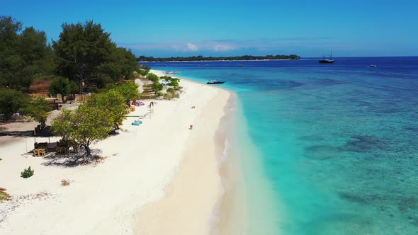 Wide angle birds eye abstract view of a paradise sunny white sand beach and aqua turquoise water