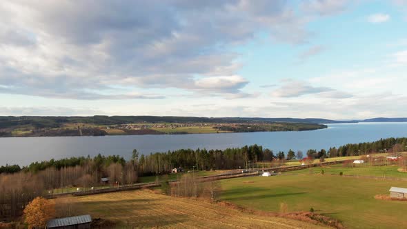 Beautiful Swedish Countryside River Lake Town Farm Fields Near Östersund, Sweden. 4K Drone.