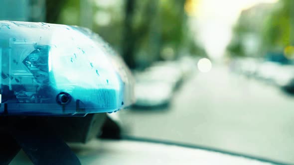 Flashing Flasher on the Roof of a Police Car. Blinker. Close-up.