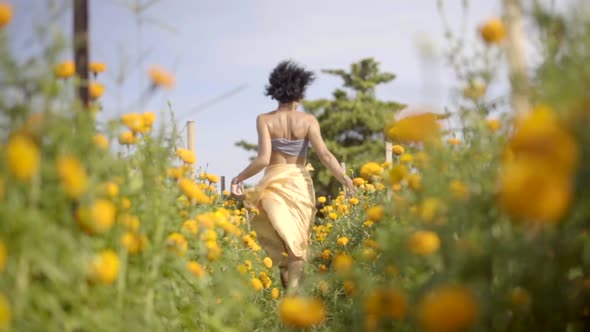 Carefree Happy Girl Running Through Vibrant Rural Field of Yellow Flowers Freedom and Harmony in