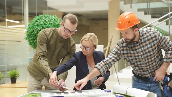 Engineers Coworking in Office Discuss Building Complex Prototype Project