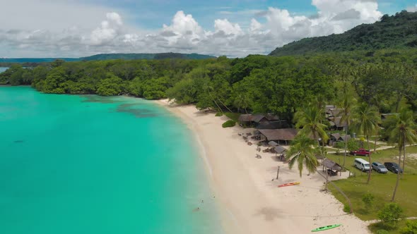 Port Orly sandy beach with palm trees, Espiritu Santo Island, Vanuatu