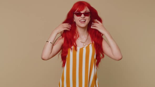 Funny Redhead Girl Making Playful Silly Facial Expressions Grimacing Fooling Around Showing Tongue