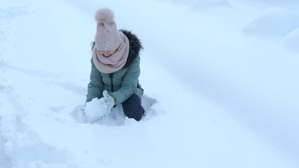 Girl Make Snow Balls