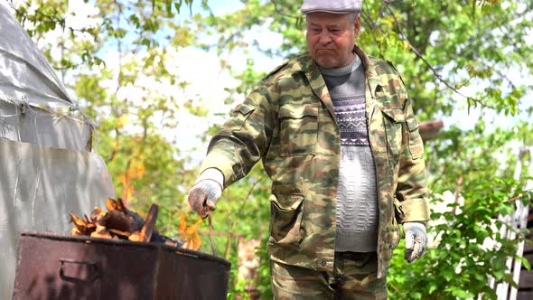 Mature Man Makes Fire in Chargrill