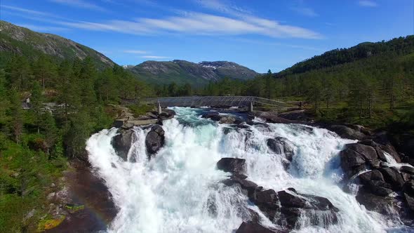 Flying close above waterfall Likholefossen in Norway