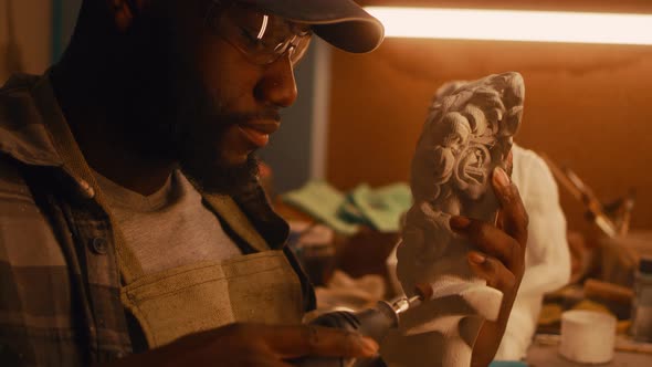 Black Sculptor Polishing Part of Bust