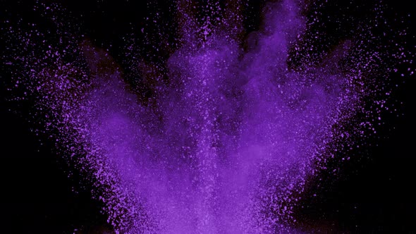 Purple powder exploding on black background in super slow motion, shot with Phantom Flex 4K alt
