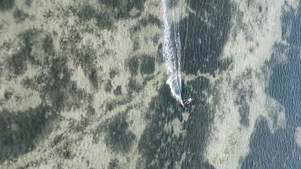 Vertical Video Kitesurfing Near the Shore of Zanzibar Tanzania Aerial View