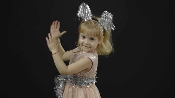 Happy Beautiful Little Baby Girl in Glossy Dress. Christmas. Make Faces, Dance