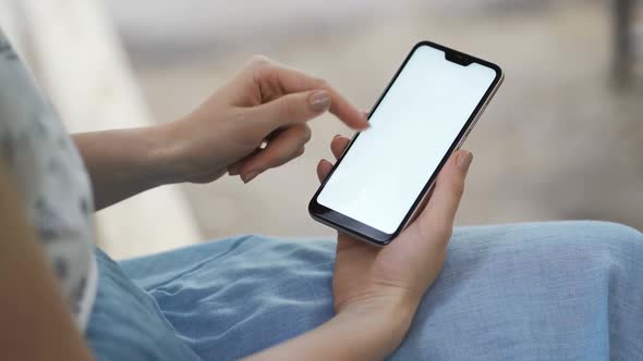 Female Hands Takes Smartphone with White Screen