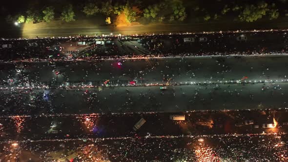 Aerial Birds Eye View Of People Walking Along Road In Karachi At Night For PTI Party Rally On 16 Apr