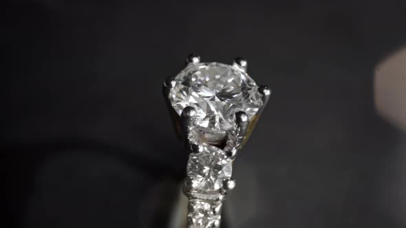 Extreme Detailed of Diamond Ring Close Up Shot While Rotating on Dark Background