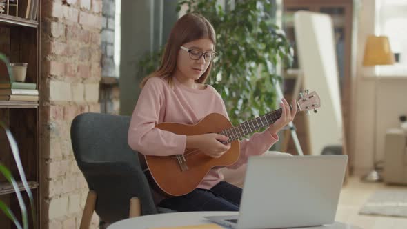 Girl Playing Ukulele