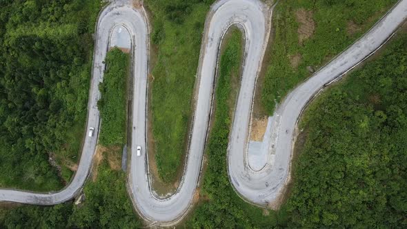 Aerial View Over Mountain Road Going Through Forest Landscape Winding Road From High Mountain Pass