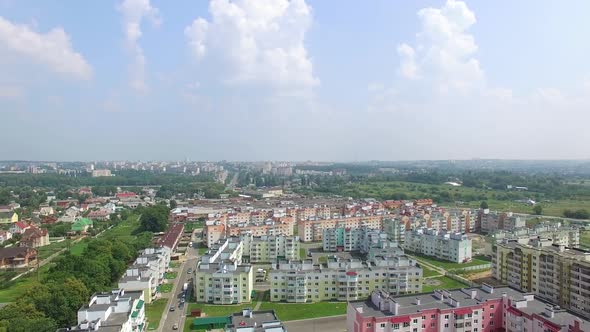 colorful modern high-rise buildings are building for people in the new quarter of the town.