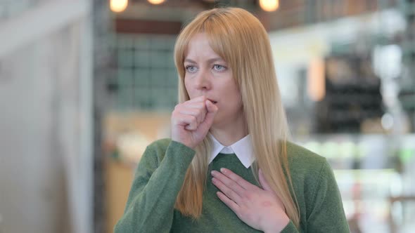 Portrait of Sick Young Woman Coughing