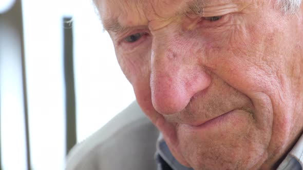 Face Portrait of Old Unhappy Frowning Senior Man