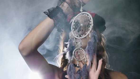 Lady Model with Skull Makeup Poses in Smoke with Dreamcatcher