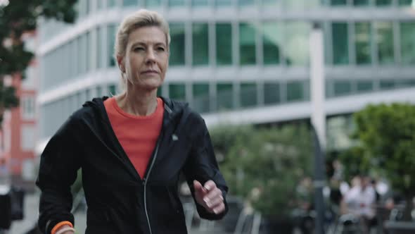 Fitness Aged Woman Having Morning Run on City Street