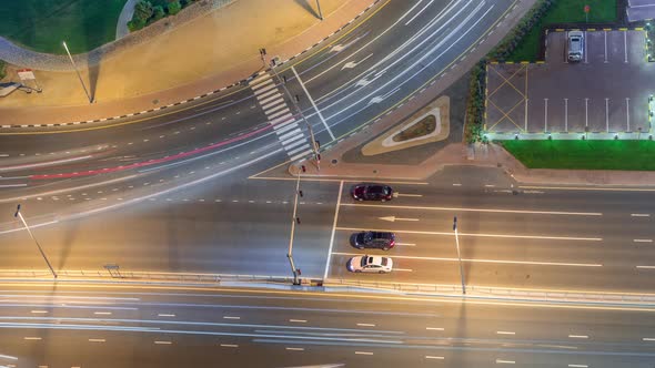 Traffic on the Road in Jumeirah Lakes Towers District Aerial Night Timelapse