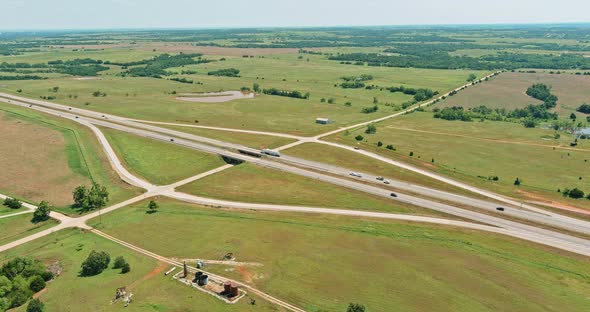 Aerial Top View Sunny Day of Highway 66 Interchange Road Near Clinton Small Town in Oklahoma USA