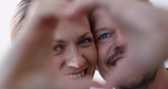 Happy Loving Couple Portrait with Handmade Heart Shaped Frame