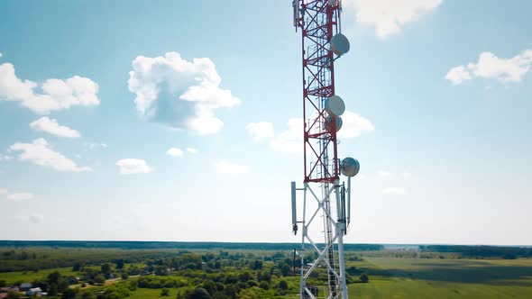 Aerial View of 4G and 5G Cell Tower with Antennas and Satellites