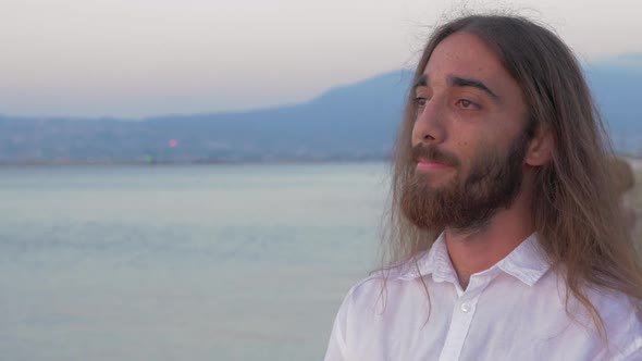 Long-haired Man with Beard on the Beach