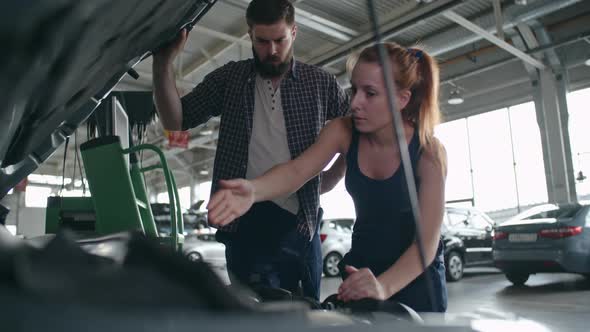 Working Together at Repair Garage