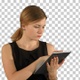 Young woman using a tablet, Alpha Channel - VideoHive Item for Sale