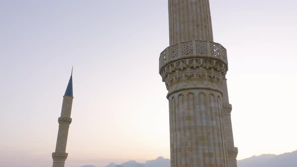 Minarets of Turkish Mosque at Sunset Sky