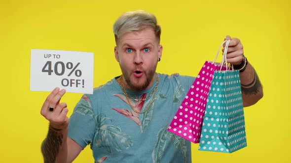 Cheerful Tourist Man Showing Shopping Bags and Up To 40 Percent Off Inscriptions Banner Black Friday