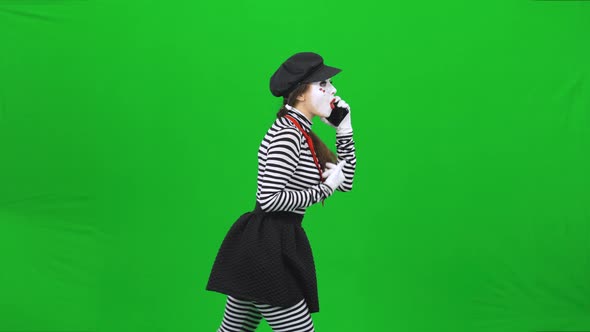 Mime Girl Going Somewhere, Talking on the Phone. Chroma Key.