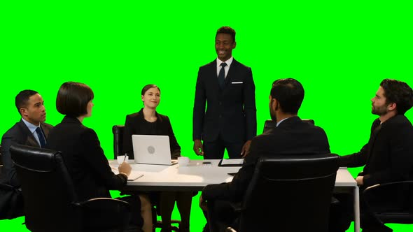 Businessman touching invisible screen during meeting