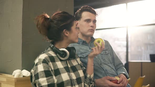 Cute Attractive Happy Couple Eating Apples From Each Others Hands