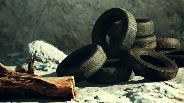 Old Tire on the Seashore and Pollution of Nature